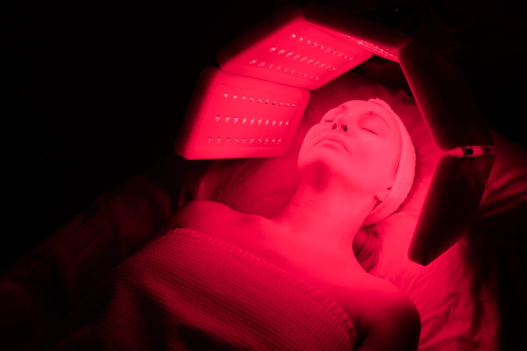 Woman undergoing red light therapy
