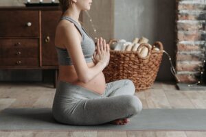 Pregnant woman practicing maternal mental health