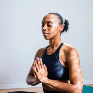 Woman practicing mental health wellness through yoga